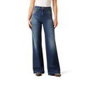Person wearing blue flared jeans on a white background
