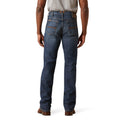 Person wearing blue jeans on a white background
