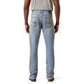 Light blue jeans worn by a person on a white background