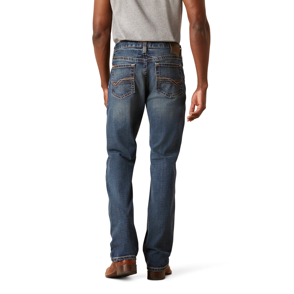 Person wearing blue jeans on a white background