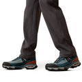 Close-up of hiking shoes with gray, blue, and orange design on a white background