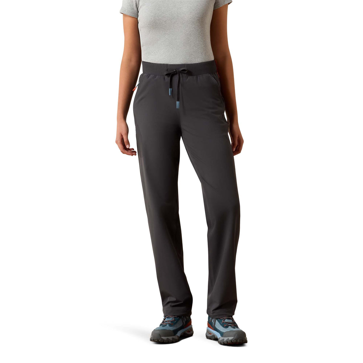 Person wearing dark gray pants on a white background