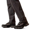 Dark gray hiking pants and shoes on a white background