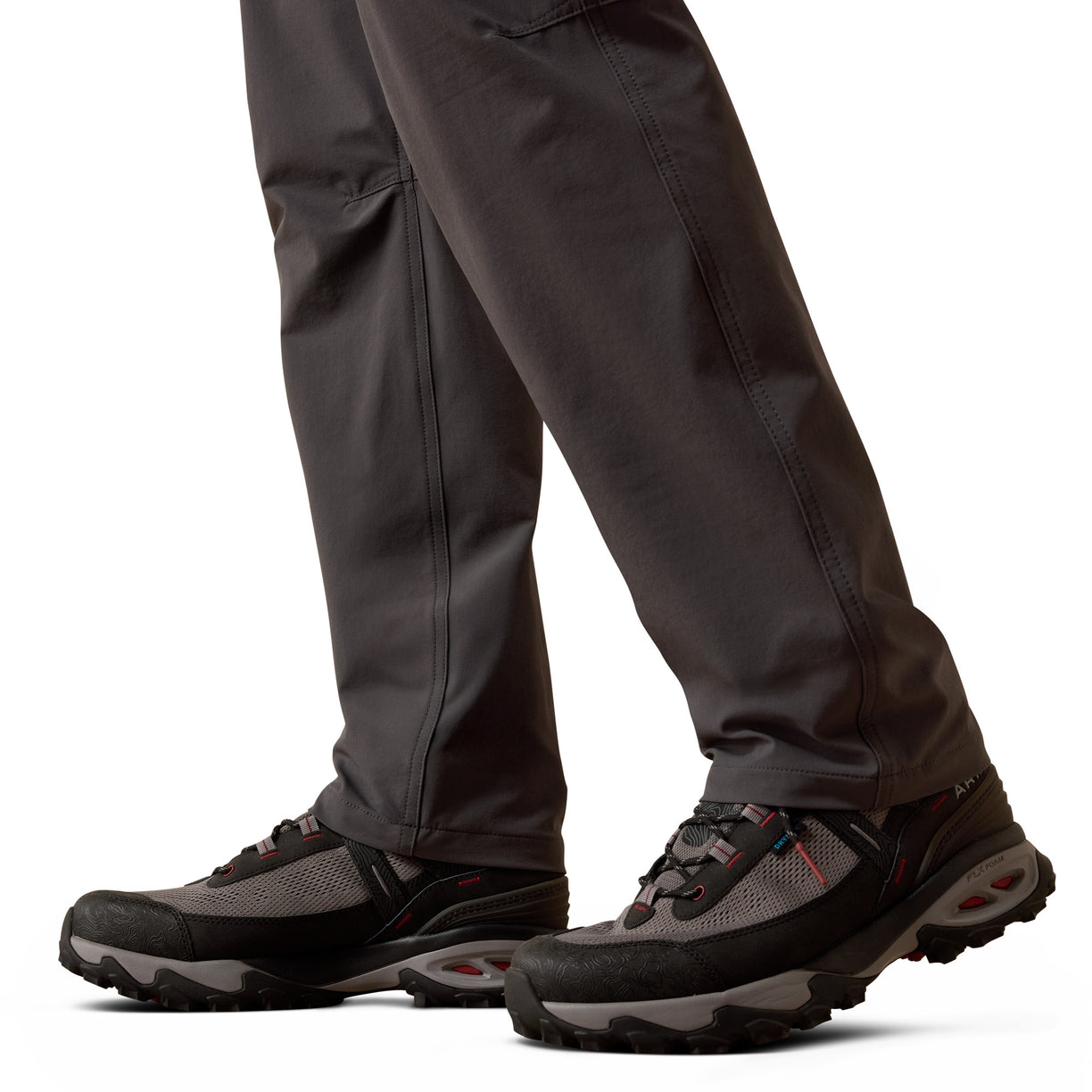 Dark gray hiking pants and shoes on a white background