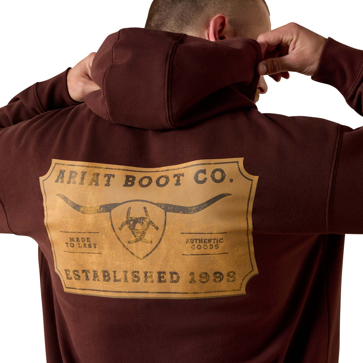 Brown hoodie with Ariat Boot Co. logo on the back against a white background