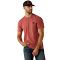 Man wearing a red t-shirt with a logo and a black cap on a white background