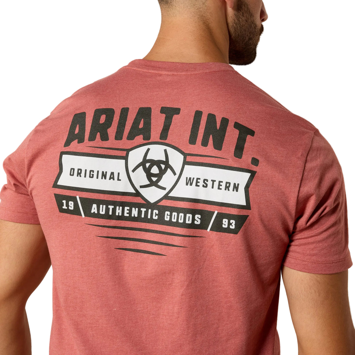 Red t-shirt with Ariat International branding on the back against a beige background