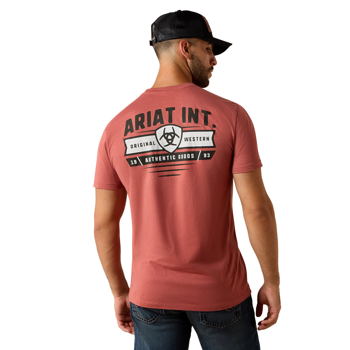 Man wearing a red t-shirt with 'Ariat Int.' branding on the back, standing against a white background.