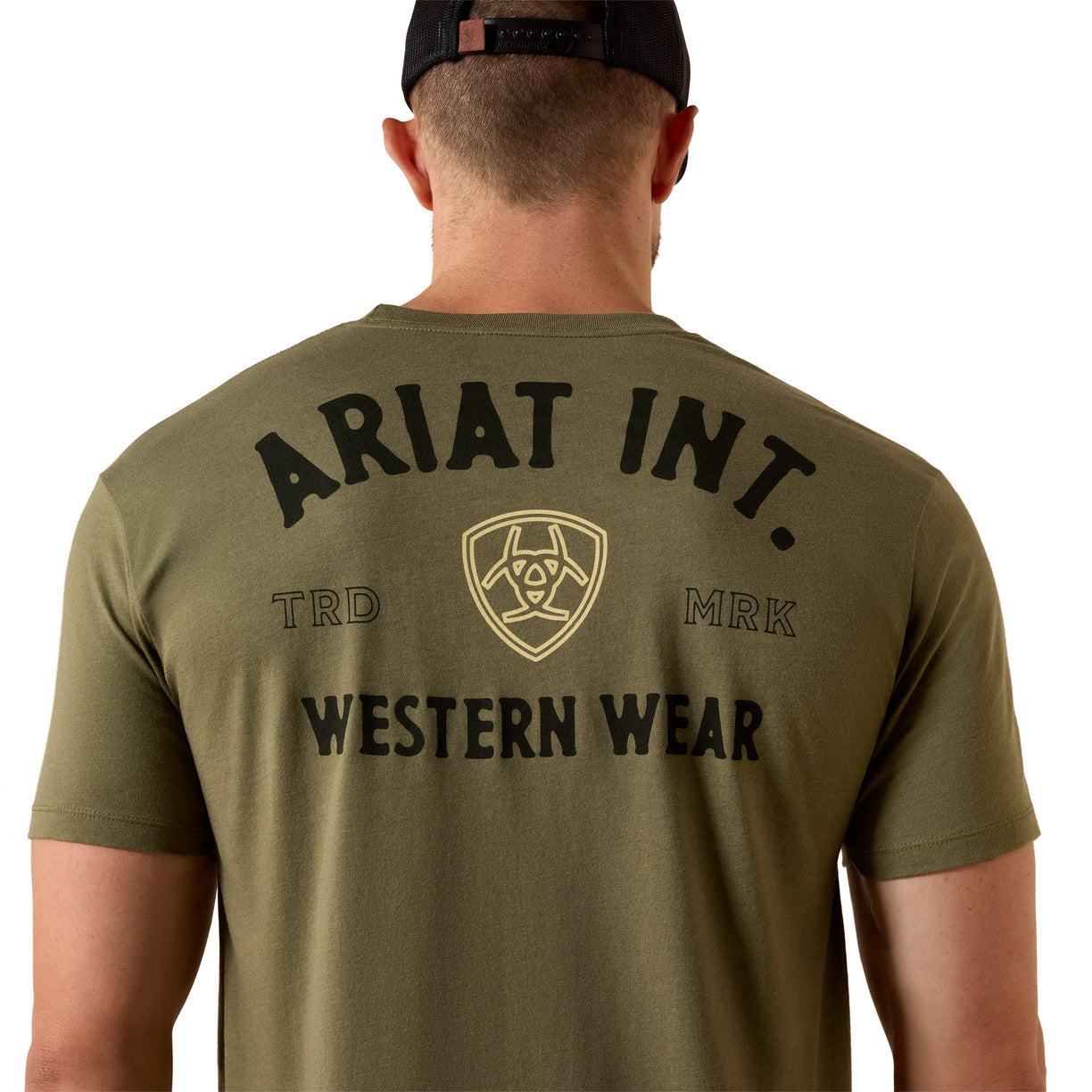 Person wearing an olive green Ariat Int. shirt with branding on the back.