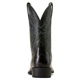 Black cowboy boot with intricate design on a white background