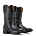 Pair of black leather cowboy boots with embossed design on a white background