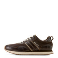 Brown sneaker with white sole on a white background