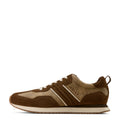 Brown sneaker with 'Ariat' branding on a white background