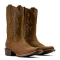 Pair of brown cowboy boots with intricate designs on a white background