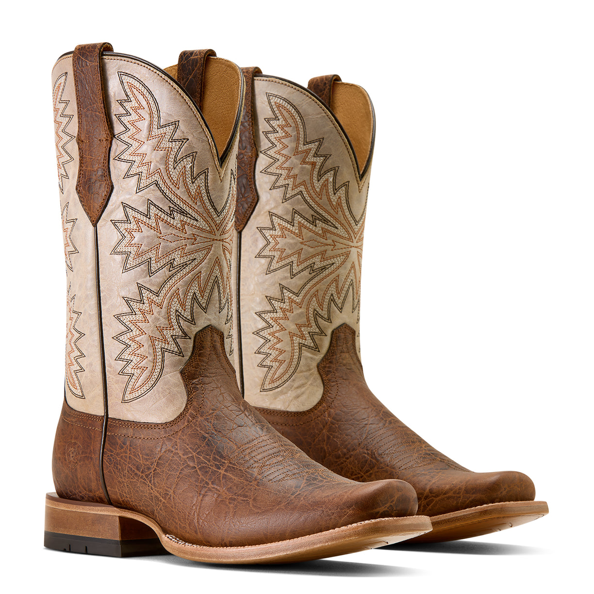 Pair of brown and beige cowboy boots with intricate patterns on a white background