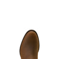 Brown leather boot sole on a light beige background