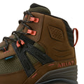 Brown Ariat boot with red laces on a beige background