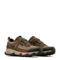 Pair of brown hiking shoes with black soles on a white background