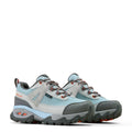 Pair of gray and blue hiking shoes on a white background