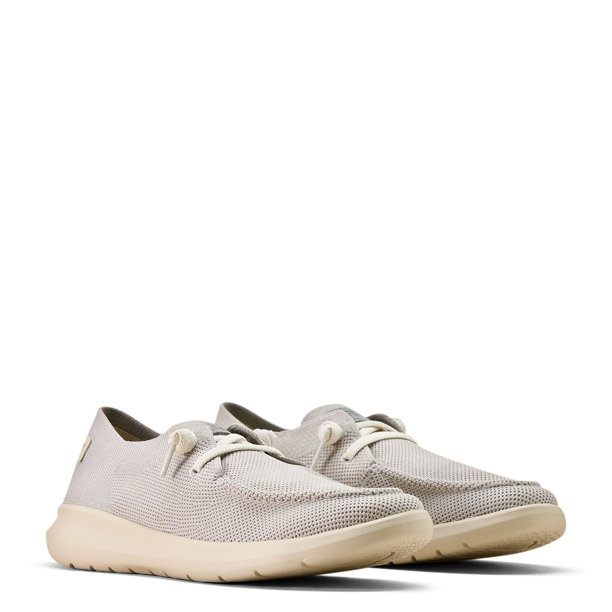 Pair of light gray sneakers on a white background
