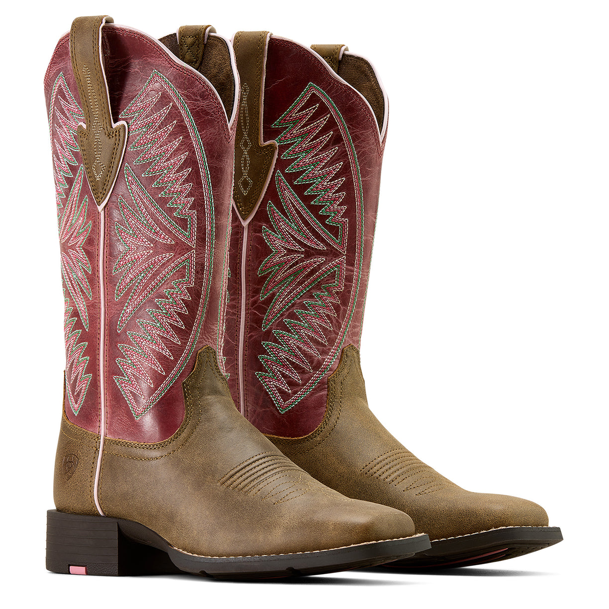 Pair of brown and red cowboy boots with intricate designs on a white background