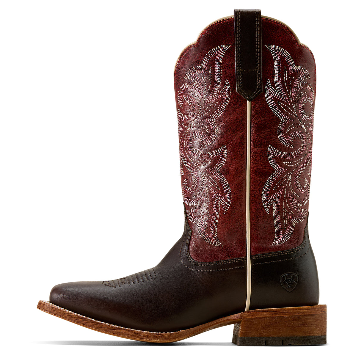 Brown and red cowboy boot with intricate embossing on a white background