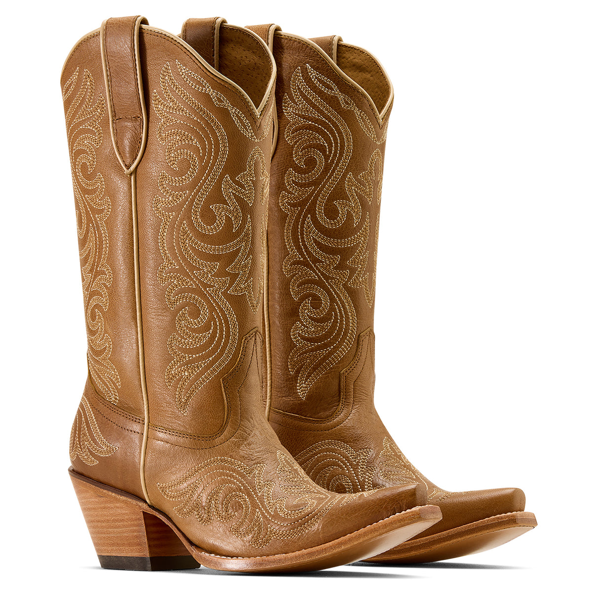 Pair of brown cowboy boots with intricate embossing on a white background