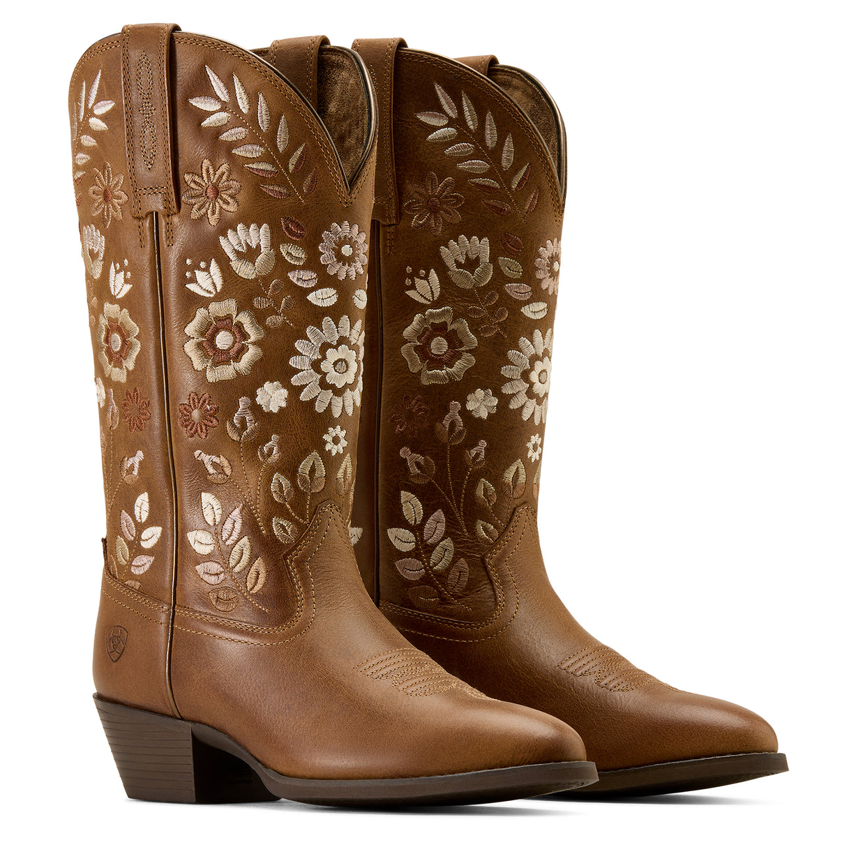 Pair of brown cowboy boots with floral embroidery on a white background