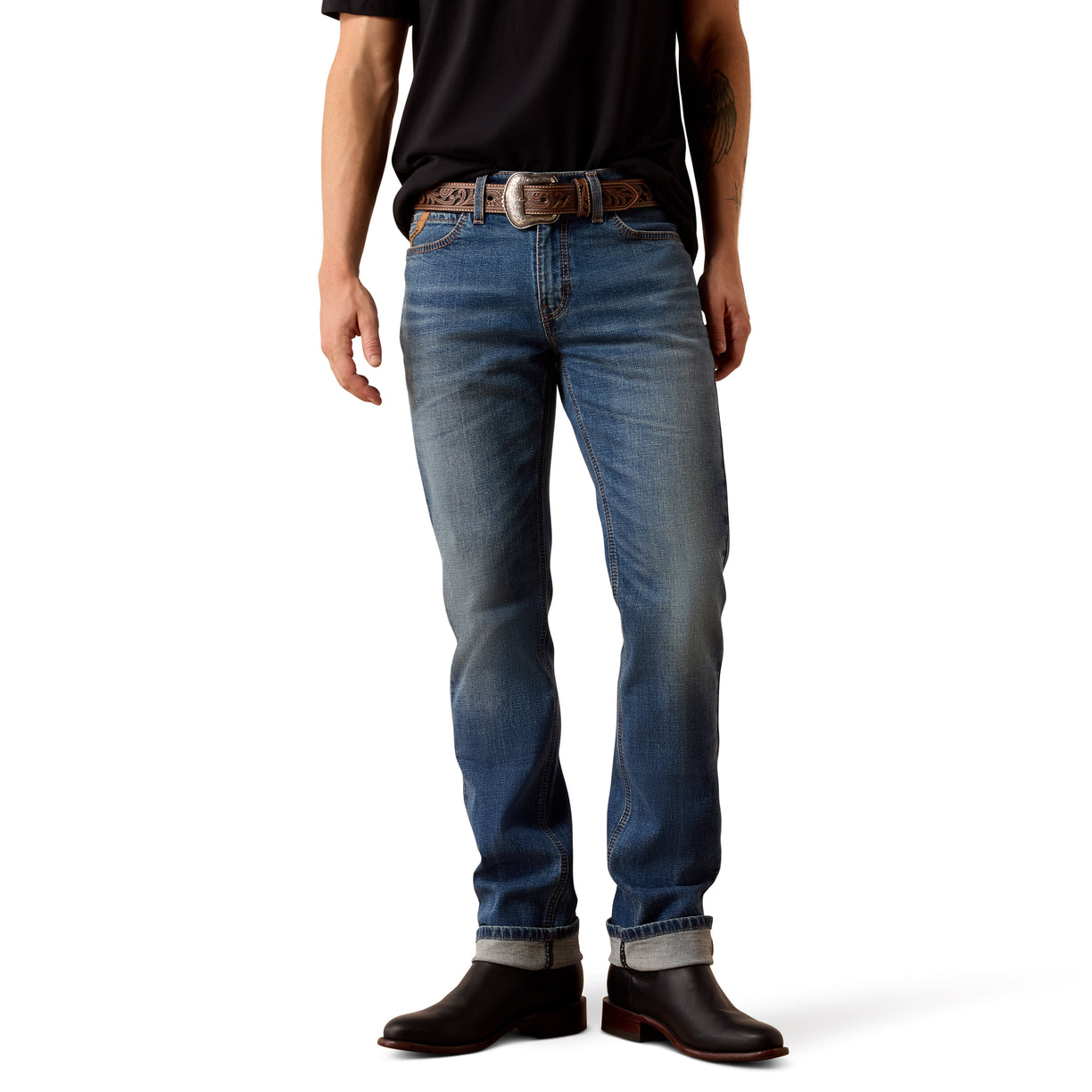 man wearing blue straight leg jeans and black shoes