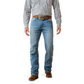 Cowboy wearing blue Ariat boot cut jeans with a checkered shirt and brown belt on a white background