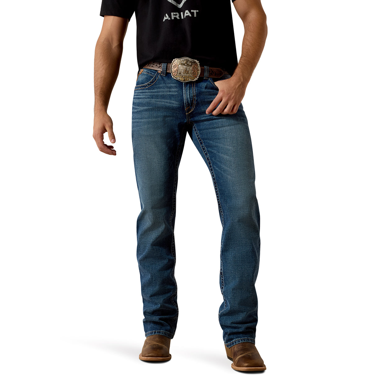 Man wearing blue Ariat Western jeans with a belt and brown boots on a white background