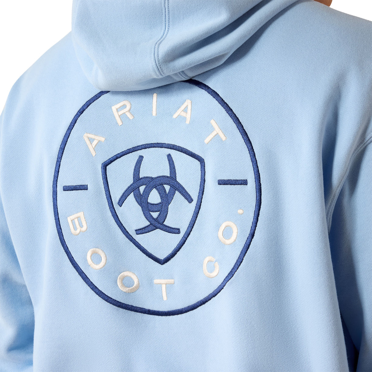 Light blue hoodie with Ariat Boot Co logo on a person wearing it