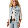 Woman wearing a light wash western style denim vest over a white shirt on a white background