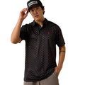 Black patterned polo shirt with embroidered logo, worn with an Ariat cap