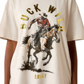 T-shirt with a graphic of a cowboy riding a horse and the text 'Buck Wild' and 'Ariat' on a white background.