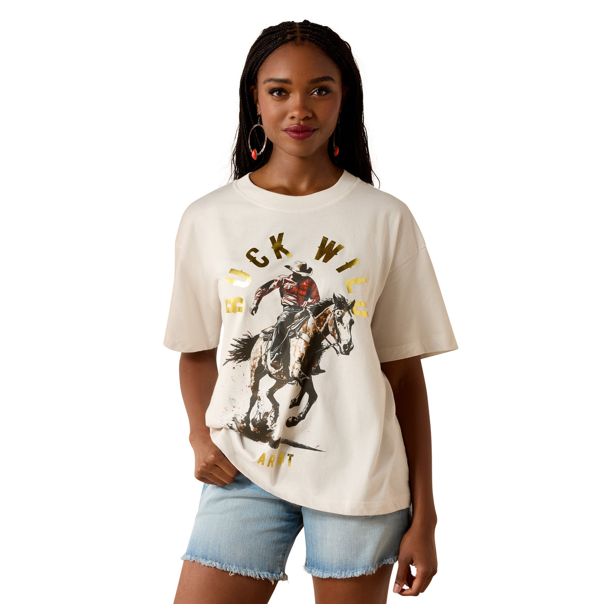 Woman wearing a white t-shirt with a graphic design of a person on a horse and text.