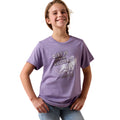 Young girl wearing a purple t-shirt with 'Dirt is Cowgirl Glitter' text and graphic