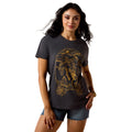 Woman wearing a dark gray western t-shirt with a gold graphic design
