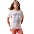 Young girl wearing a white t-shirt with a horseshoe and rose design 