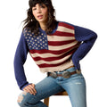Person wearing a sweater with an American flag design on a white background