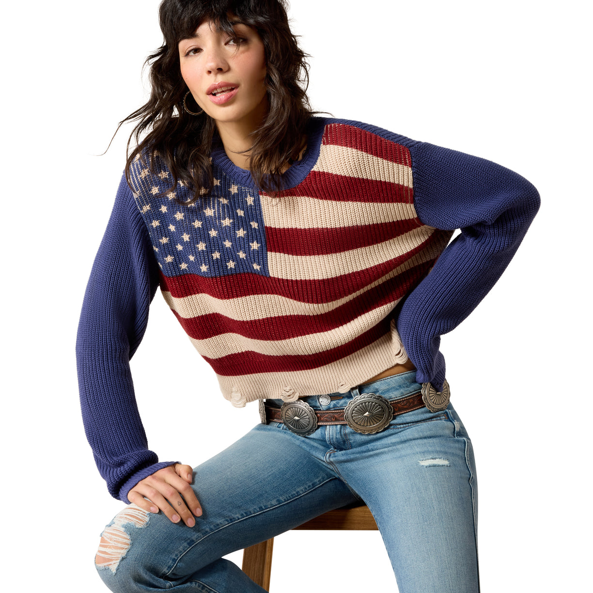 Person wearing a sweater with an American flag design on a white background