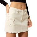 White denim skirt with star cutouts worn by a person on a white background