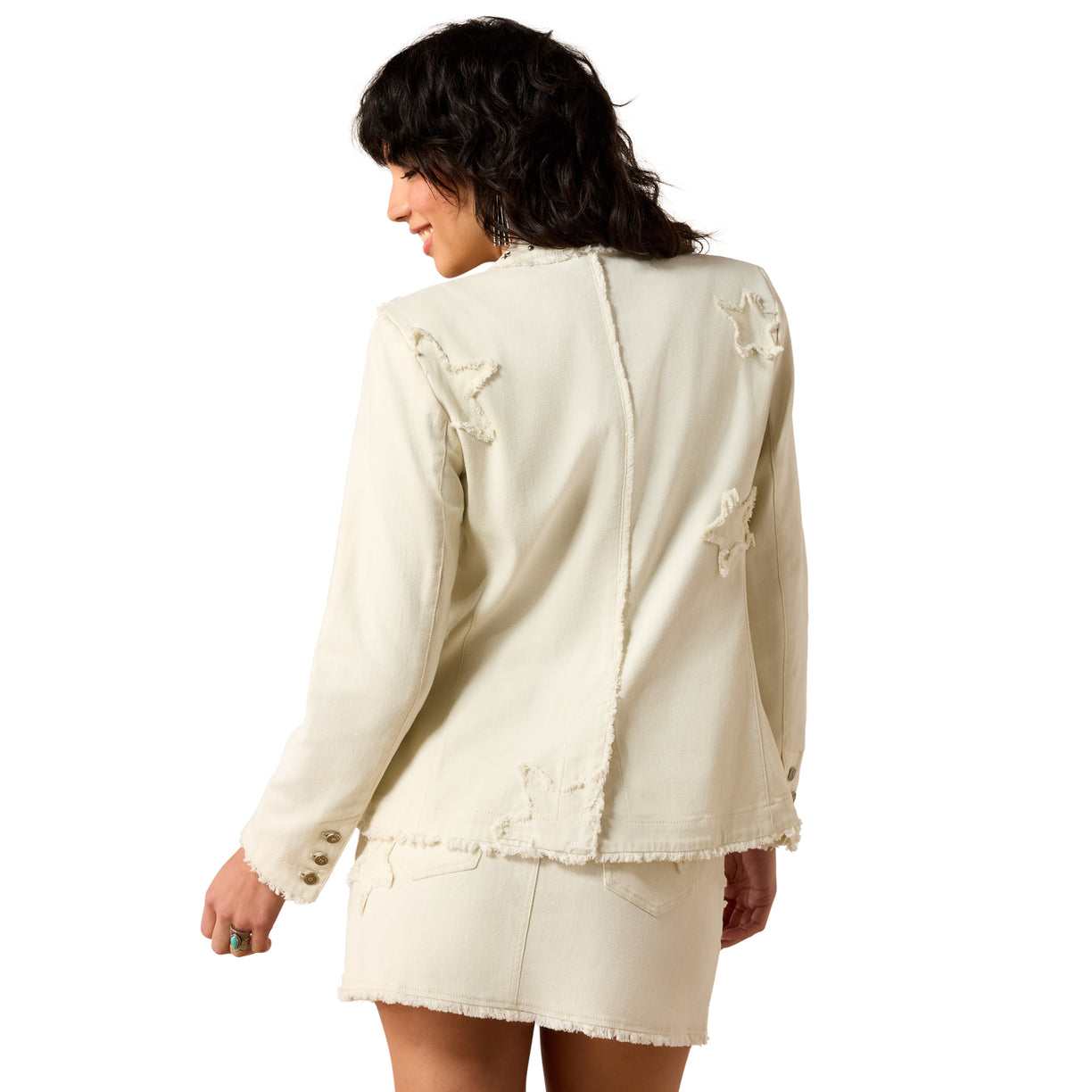 Woman wearing a white jacket and skirt set on a white background