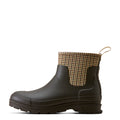 Dark rubber boot with houndstooth patterned cuff on a white background