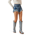 Person wearing denim shorts with star patterns and gray knee-high boots on a white background