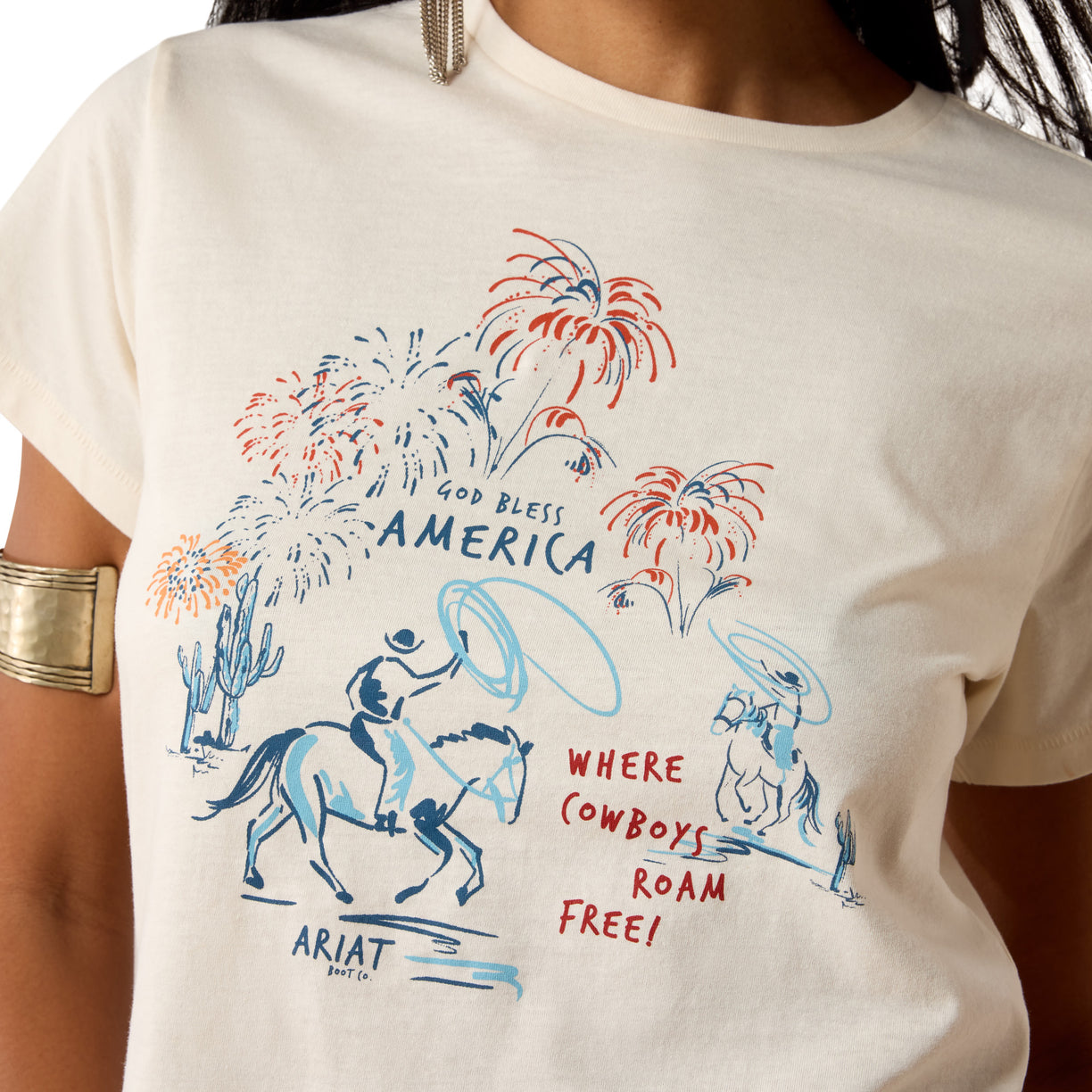 White t-shirt with patriotic design featuring horses, fireworks, and text on a person wearing it.