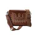 Brown leather crossbody bag with an embroidered eagle boot stitch design on the flap