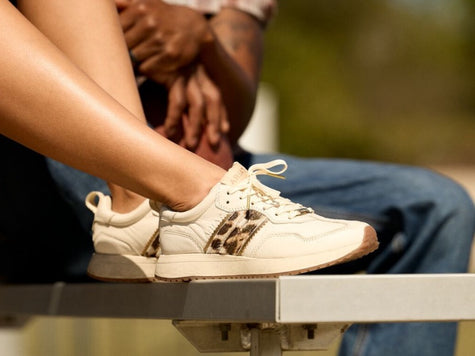 Ariat Ranch Runner - New Casual Footwear with a nostalgic, cool vibe worn by female model close up on shoes.
