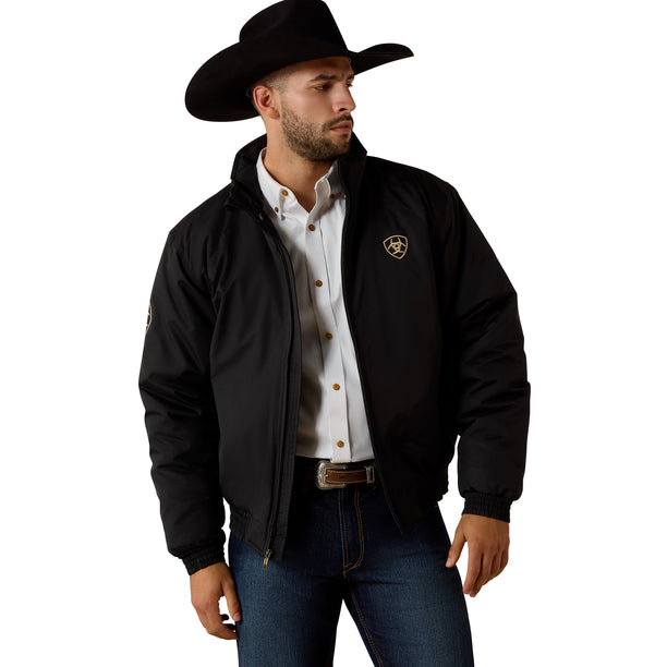 Man wearing a black jacket with a logo, white shirt, and jeans on a white background
