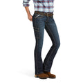 Person wearing blue jeans and a plaid shirt on a white background